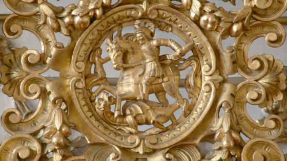 St George slaying the dragon, gilt and carved decorative element of a wooden chair back, music room, Eszterhazy castle, Fertod, Gyor-Moson-Sopron. Hungary, 18th century.