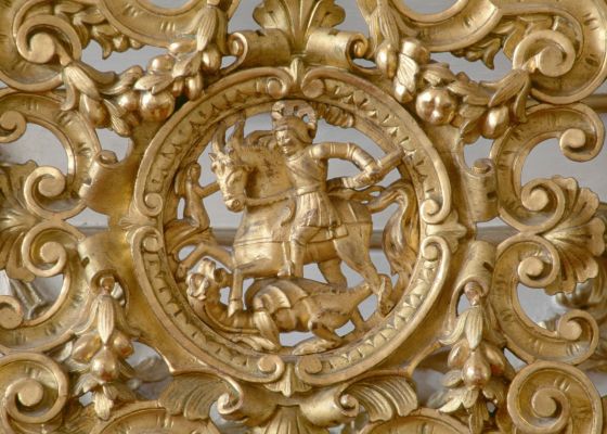 St George slaying the dragon, gilt and carved decorative element of a wooden chair back, music room, Eszterhazy castle, Fertod, Gyor-Moson-Sopron. Hungary, 18th century.